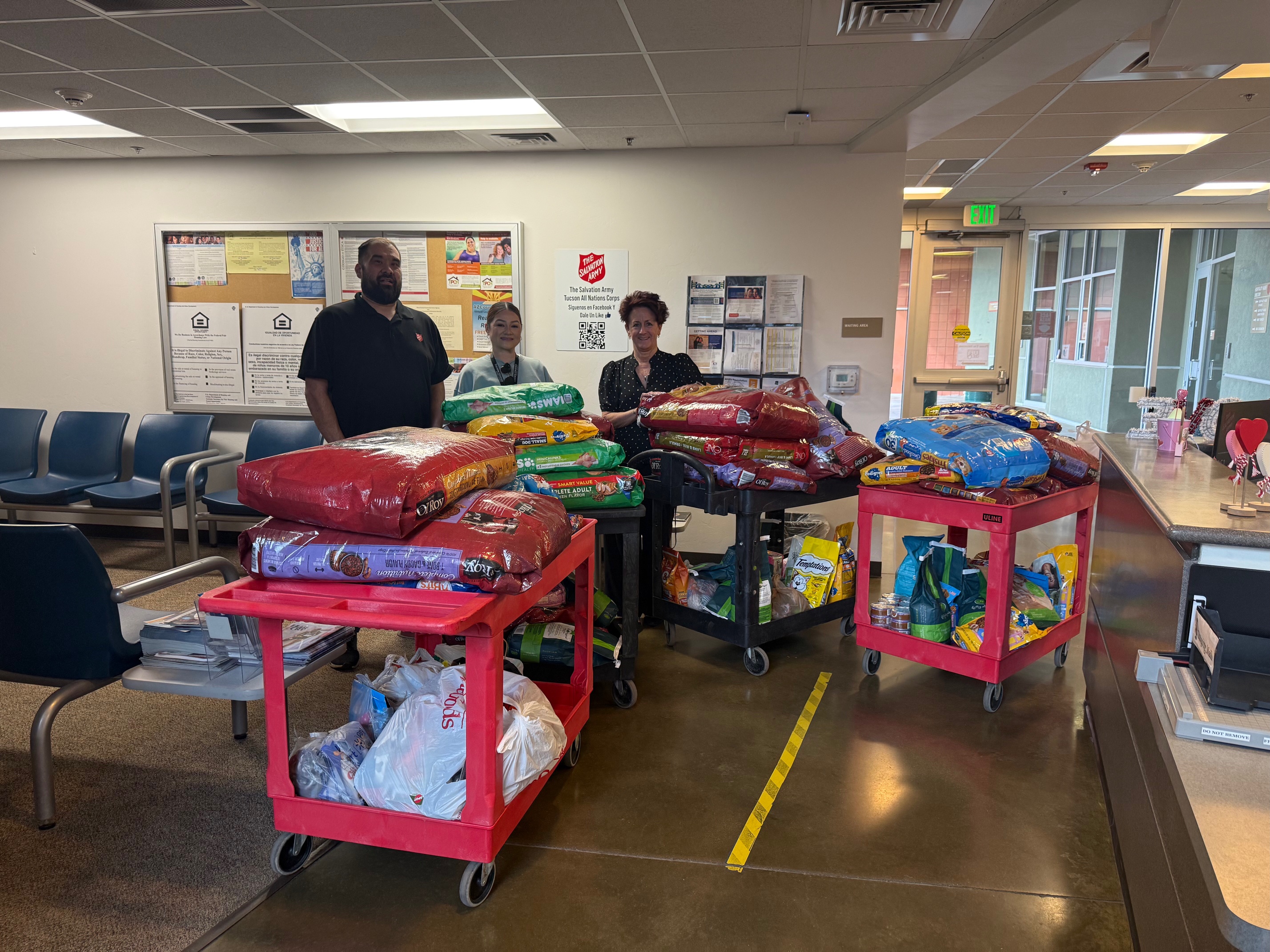 Bags of pet food piled up on carts