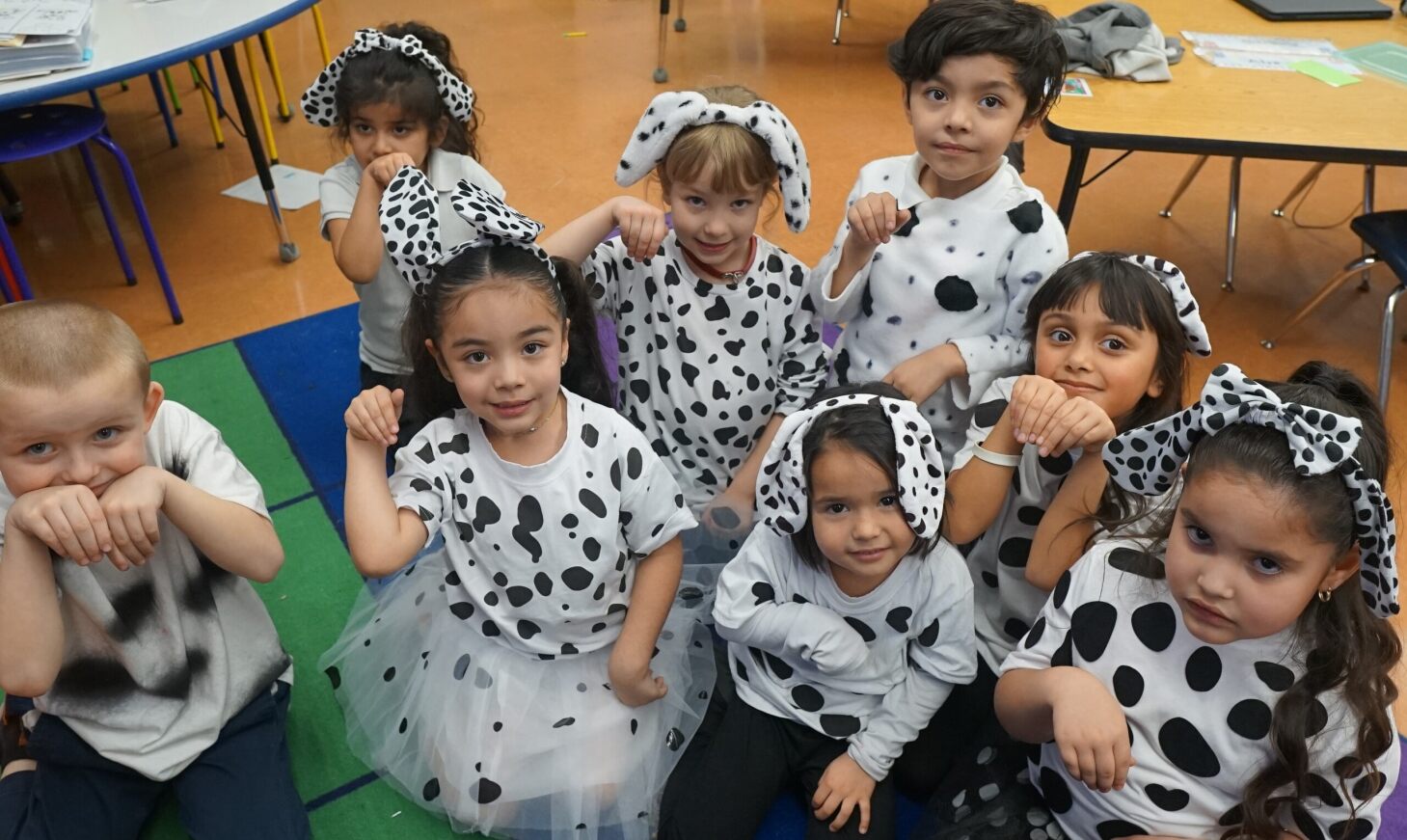 Students pose as the 101 Dalmatians on the 101st day of school